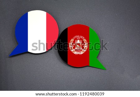 France and Afghanistan flags with two speech bubbles on dark gray background