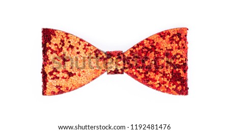 Glamorous red sparkling glitter decorated bow isolated on white background.