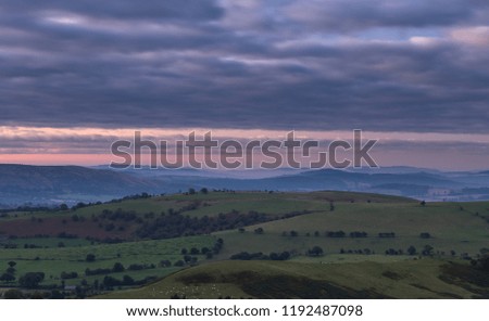 Vantage view over hilly countryside fields in Shropshire, United Kingdom
