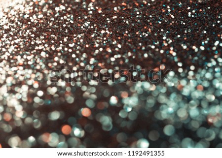 festive multicolor and blue glitters background with bokeh and light leaks effect