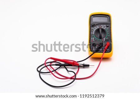 Electric multimeter with red and black probe, display turned off. Isolated on a white background with a clipping path.