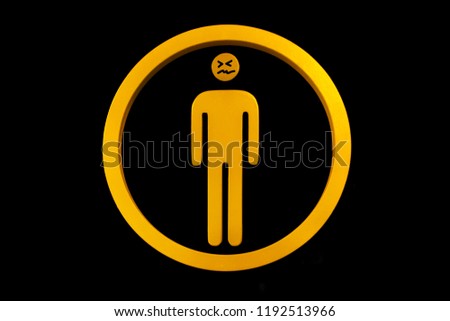 yellow men with painted Confounded Face toilet sign on black wall tile at the entrance to WC. Confounded Face. Symbol and bathroom for men. Symbols for restrooms man with a circle style on black
