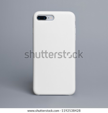 Smart phone on a gray background in a white plastic case back view. Template of smart phone case Royalty-Free Stock Photo #1192538428