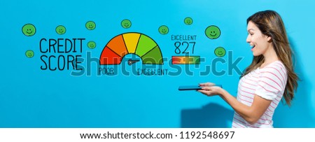 Excellent credit score with young woman using her tablet