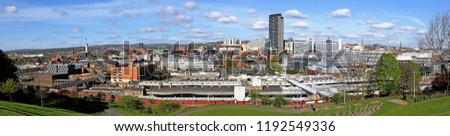 Panoramic view of Sheffield from ground above the station overlooking Sheffield Hallam University and the station, Arundell Gate, on a clear summer's day, few floaty clouds, stitched photo Royalty-Free Stock Photo #1192549336