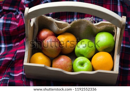 Orange, red apples, green apples in crates, fresh fruits