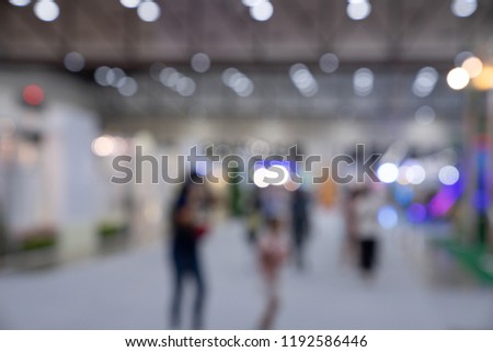 Blur picture : people are walking in trade fair