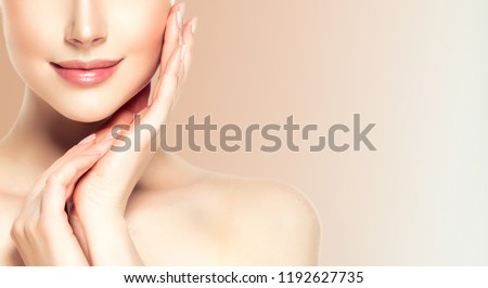 Beautiful young woman with clean fresh skin. 
 Royalty-Free Stock Photo #1192627735