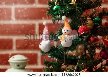 Accessories Christmas and Happy New Year There are snowballs. Christmas tree Decorated with gift boxes. In a room with a red wall. Suitable for decoration in festivals of happiness. copy space