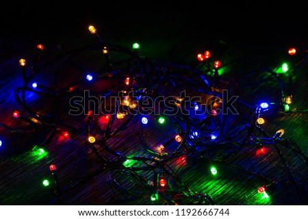 Lights of a New Year garland on a black background