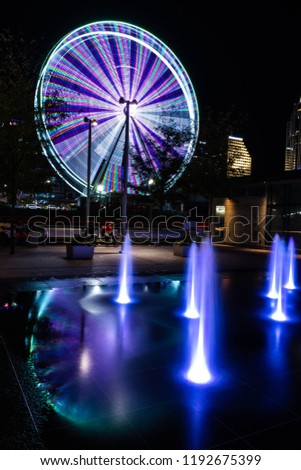 A long exposure reflection of a ferris wheel, in Cincinnati Ohio.