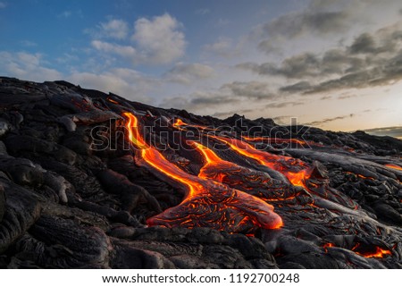 lava flowing down a hill Royalty-Free Stock Photo #1192700248