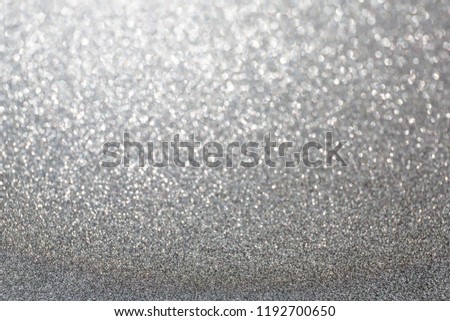The Glittering glitter background with a bokeh.