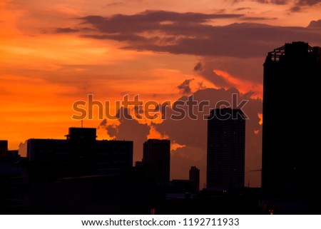 Sky with clouds over the evening city with sunset. 