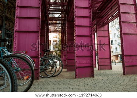Pink metallic design near the library in Warsaw. Cityscape background