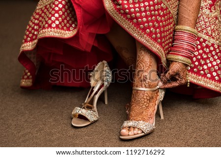 Pakistani Indian bridal wearing Sandal shoes and foot mehndi design Royalty-Free Stock Photo #1192716292