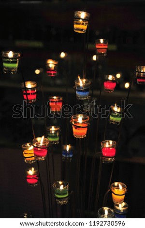 Many beautiful candles.