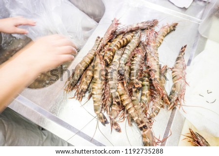 Tiger shrimps on the silver sink in the restaurant