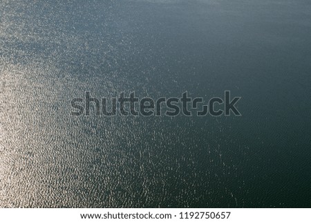 Texture water . Sea  texture background  and light from the sun . For add text . Abstract background photo.