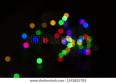 Colorful christmas bokeh isolated on black background. Christmas tree light background. New year decorations.