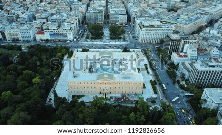 Aerial dramatic photo of famous Greek Parliament as seen on a heavy cloudy evening at dusk with beautiful colours