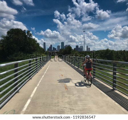 Female Social Distancing On Bike Ride In Houston Texas