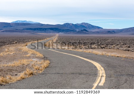 USA, Nevada,Mineral County. The only curve before a long straightaway on the road to Candelaria and Metallic City.