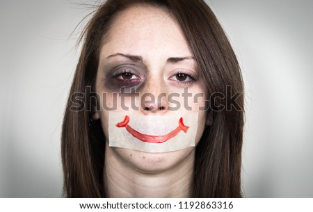 Stop violence again woman. Portrait of a woman after abuse. Royalty-Free Stock Photo #1192863316