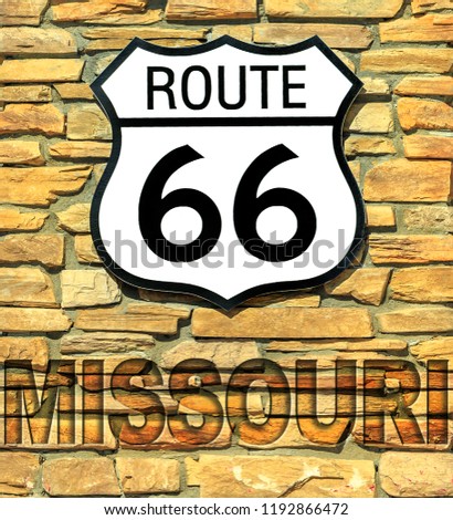 United States historic Route 66 road sign of Missouri on a brick wall. American highway from Chicago city of Illinois to Santa Monica town in California.