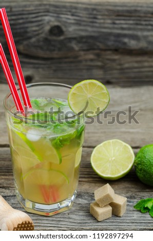 Mojito drink on wooden rustic background. Mojito cocktail 