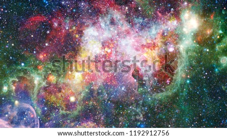 Colored clouds in nebula. Combined version of Hubble space telescope image. Elements of this image furnished by NASA.