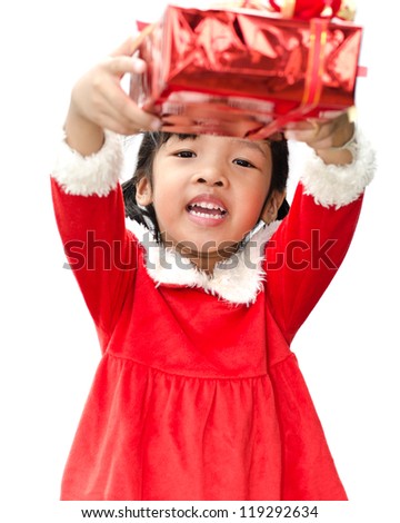 little girl dressed as Santa Claus with christmas gift.