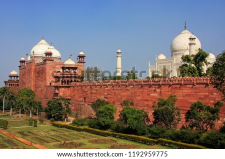 View of Taj Mahal and sandstone wall surrounding the complex, Agra, Uttar Pradesh, India. Taj Mahal was designated as a UNESCO World Heritage Site in 1983.