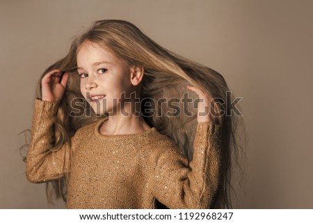 model child hip-hop. baby with long hair.