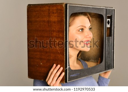 retro television. woman with retro television set on head. retro television set in hands of girl. retro television concept. watch tv