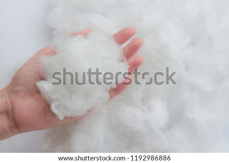 Woman hand holding Polyester stable fiber Royalty-Free Stock Photo #1192986886