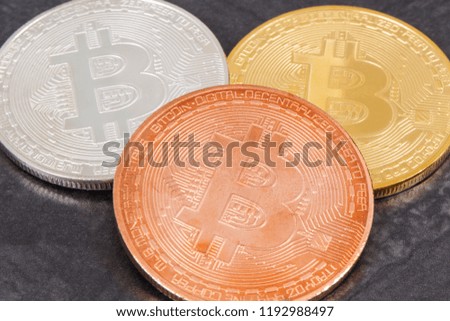 Bitcoin coins as symbol of cryptocurrency on dark background, concept of modern finance and banking