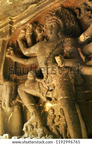 Multi Handed Hindu god on the walls of Ellora