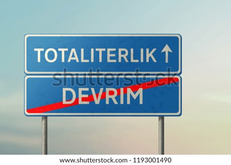 totalitarianism and revolution  - blue road sign with inscriptions in Turkish