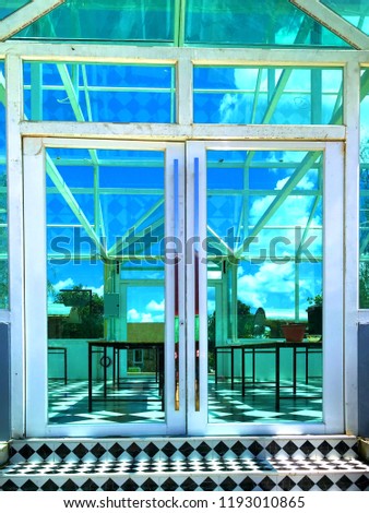 Modern door in glass house 