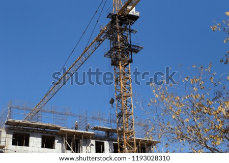 Building a high-rise building with a tower crane