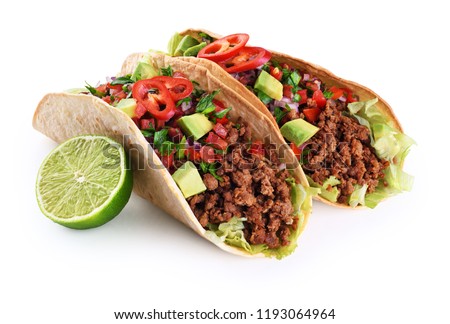 Mexican tacos with beef, tomatoes, avocado, chilli and onions isolated on white background. With clipping path. Royalty-Free Stock Photo #1193064964
