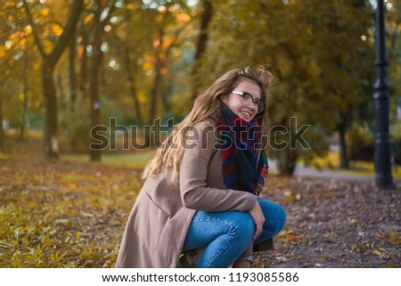 Portrait of a beautiful girl in park. Teenage girl with glasses. Close up photo. Young student have fun. Lifestyle photo.