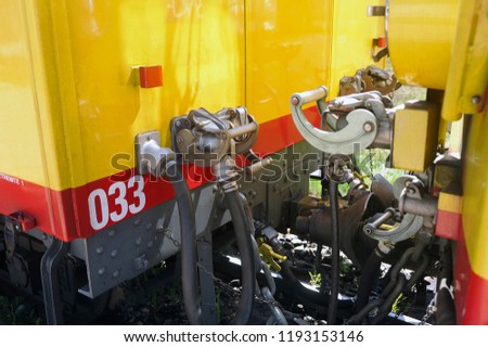 Fastening system of the wagons of the little yellow train in close up