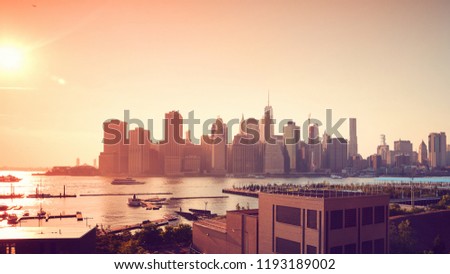 Manhattan at sunset, color toning applied, New York, USA.