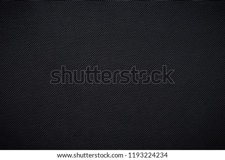 Black woven carbon fiber sheet texture background