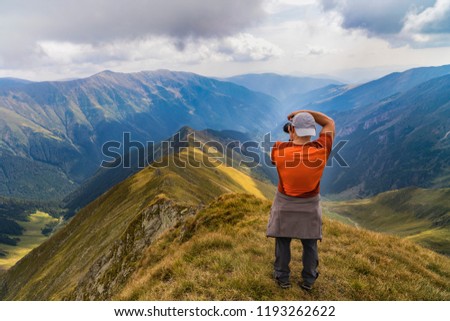photographer taking pictures on the mountain