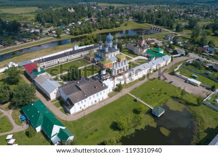 A view from the height of the Tikhvin Assumption Monastery on a July afternoon (aerial photography). Tikhvin, Russia