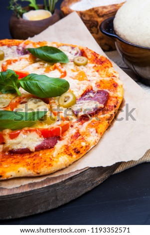 Delicious fresh pizza in dark
