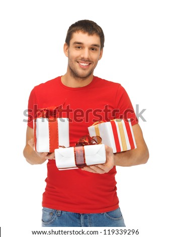 bright picture of handsome man holding many gift boxes.